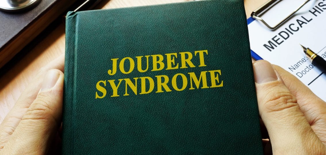 leather bound book on a doctor's desk reading Joubert Syndrome