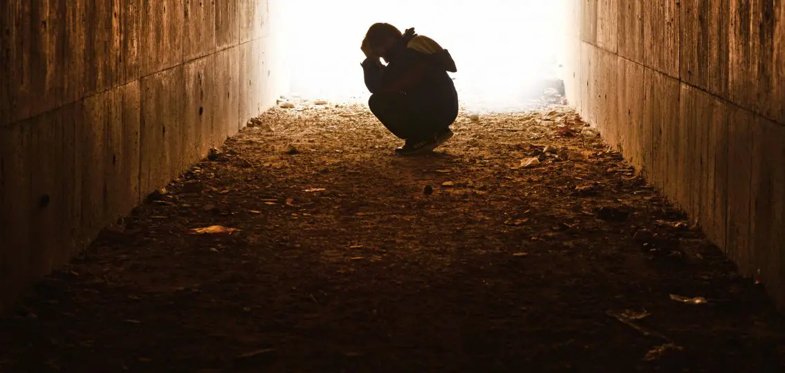 head in the tunnel waiting hands of underprivileged children alone