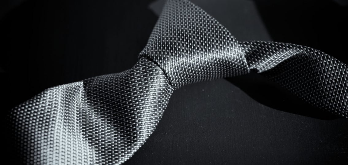 Grey tie reminiscent of the Fifty Shades of Grey book cover