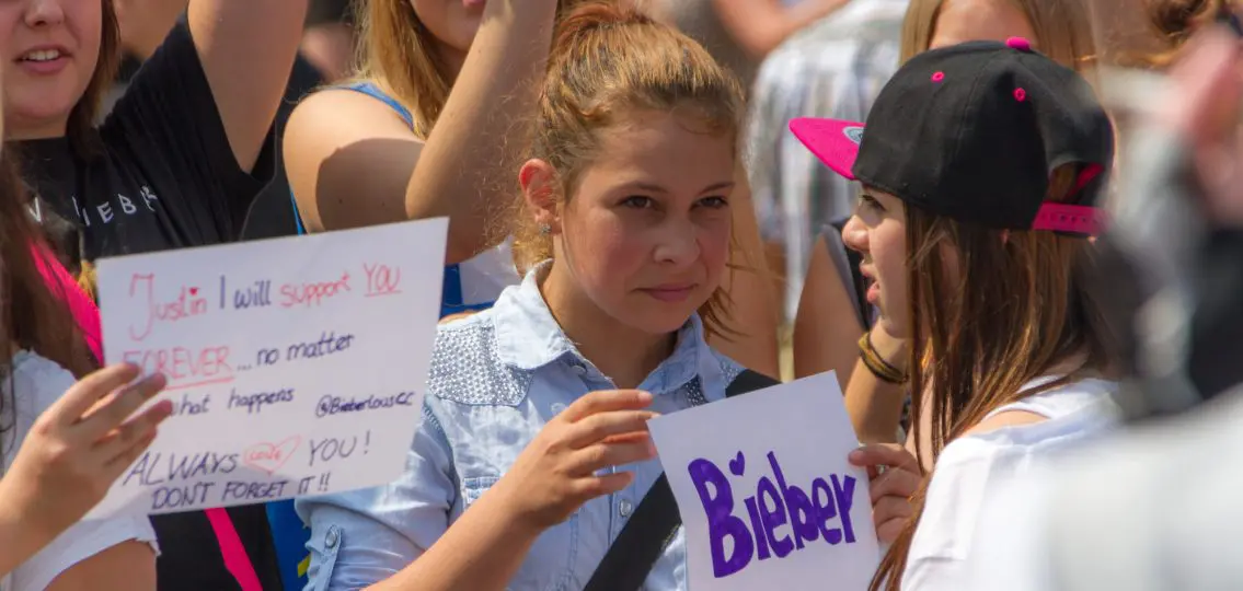 STUTTGART, GERMANY - CIRCA JUL 2013 - Teenage girls demonstrate for their idol, Justin Bieber on July 13th, 2013 in Stuttgart. Fans of Justin Bieber call themselves 'Belieber'.