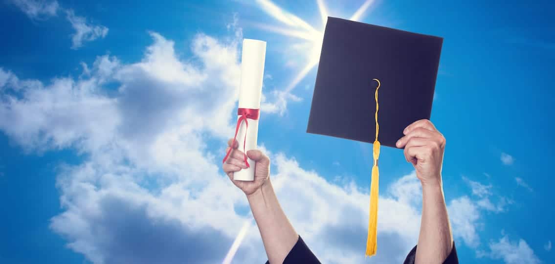 graduate with cap and diploma in the sky