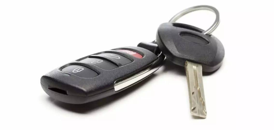 close up of lost car keys on white background