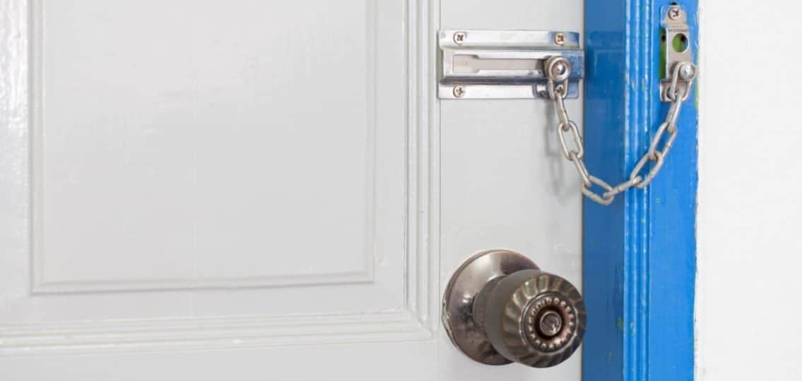locked door with a padlock blue door frame