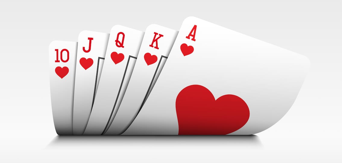 Royal flush playing cards poker hand on white background.