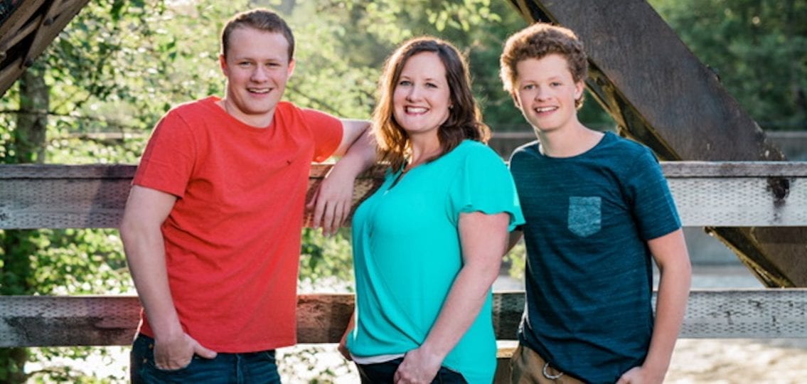 Kelli Smith and her two sons outside in a park