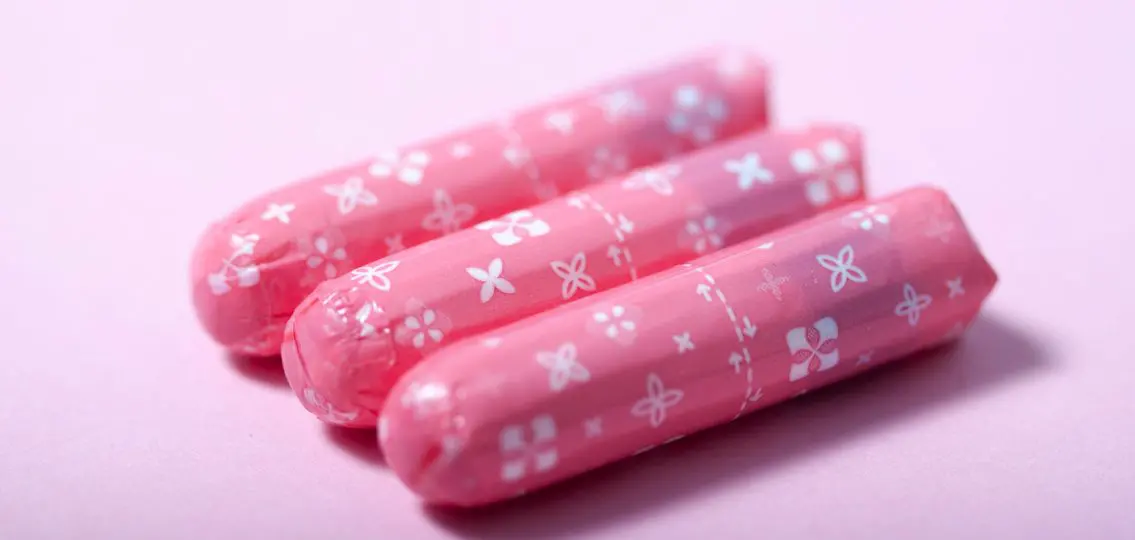 several wrapped tampons in pink wrappers