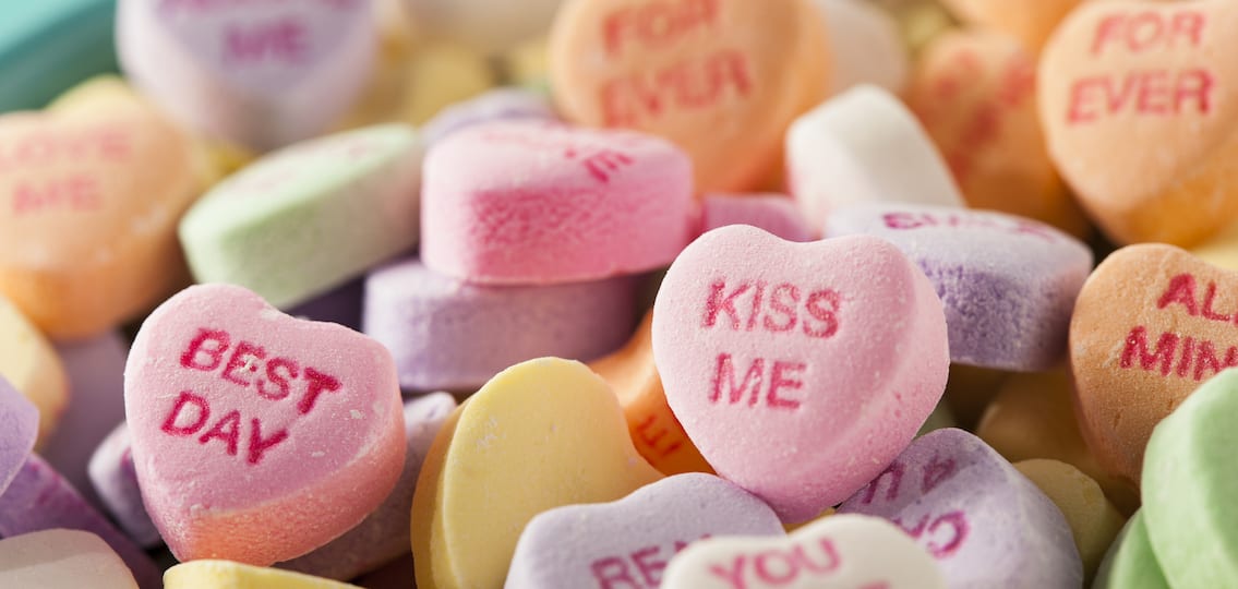 Candy hearts for Valentines Day reading kiss me and best day and more