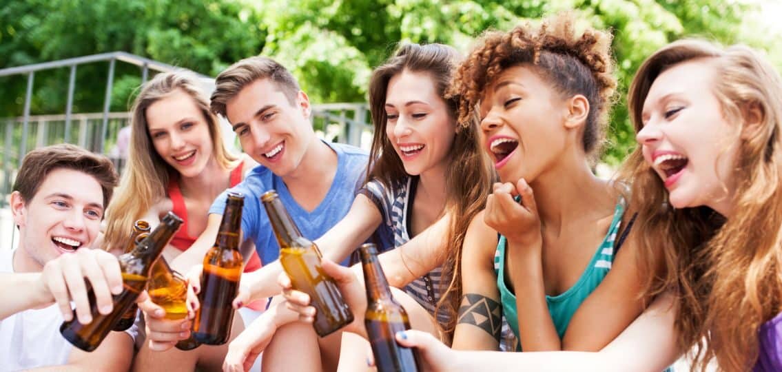 teens drinking together and laughing