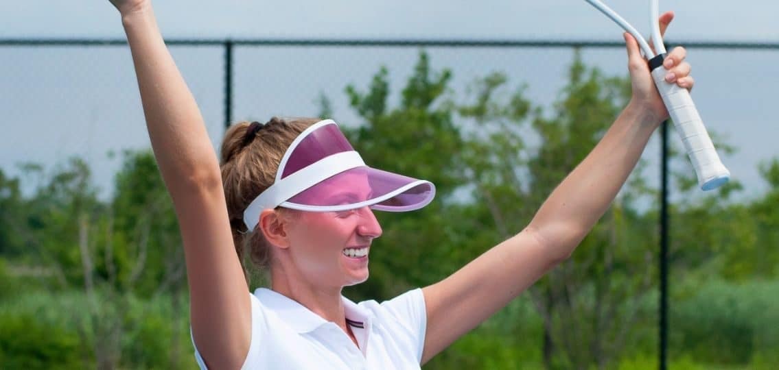 Teen celebrating success during a tennis match