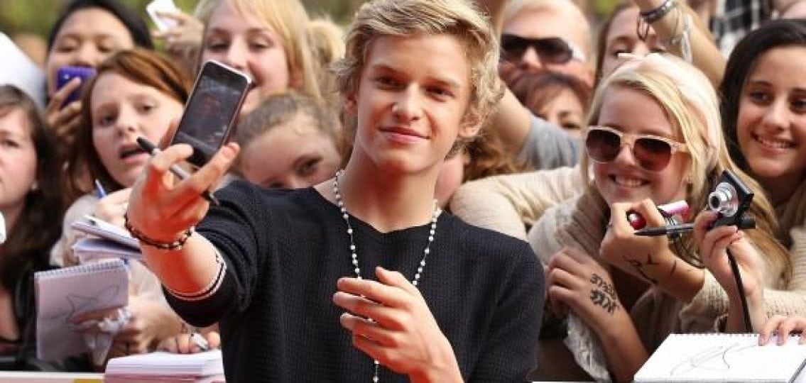 Cody Simpson taking a selfie with fans