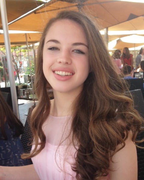Elizabeth Seigler Walker, teenage girl with brown curly hair and green eyes.