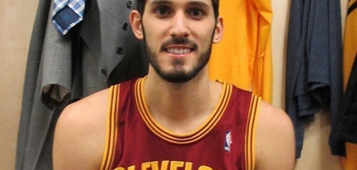 Omri Casspi in Cleveland Caveliers Uniform in front of other clothes
