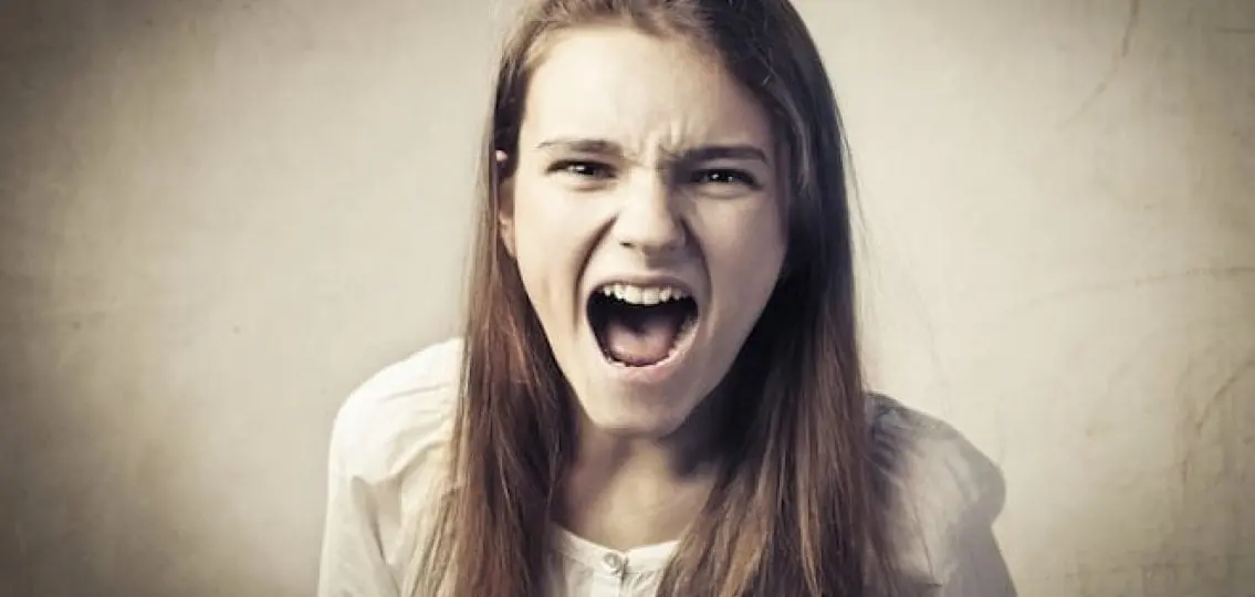 angry screaming teen girl sepia tone