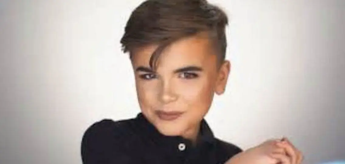 young teenage boy wearing makeup