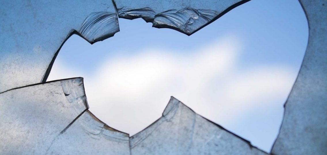 close up of a broken dirty window