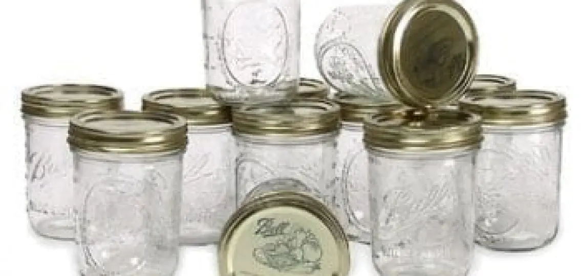 a dozen empty glass jars