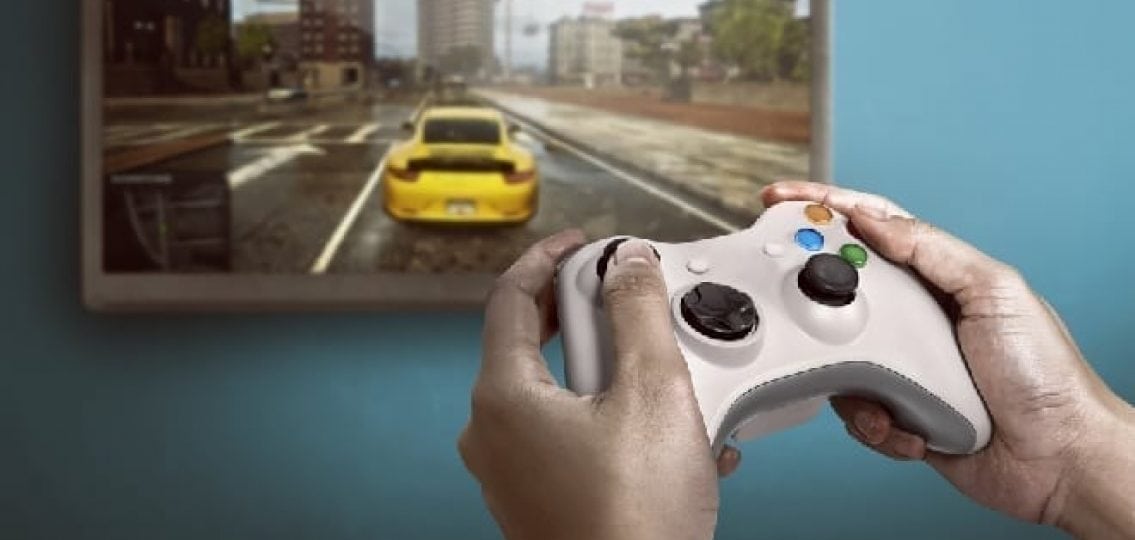 hands playing on an xbox controller a game reminiscent of GTA V