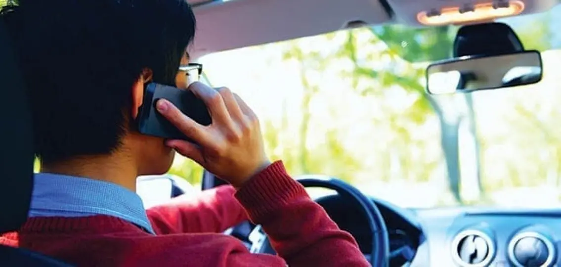 driver talking on a phone while driving