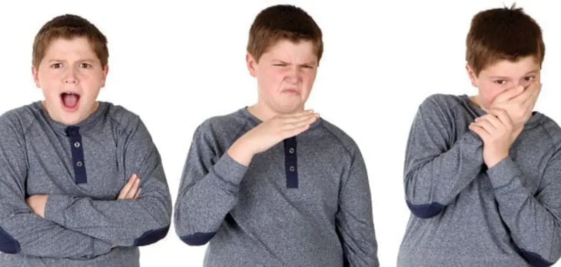 several images of a young teenage boy covering nose smelling something foul