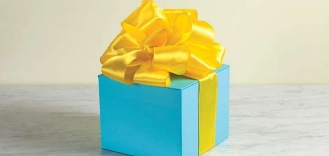giftbox blue gift present wrapped in a yellow bow
