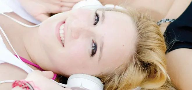 teenager with headphones listening to music