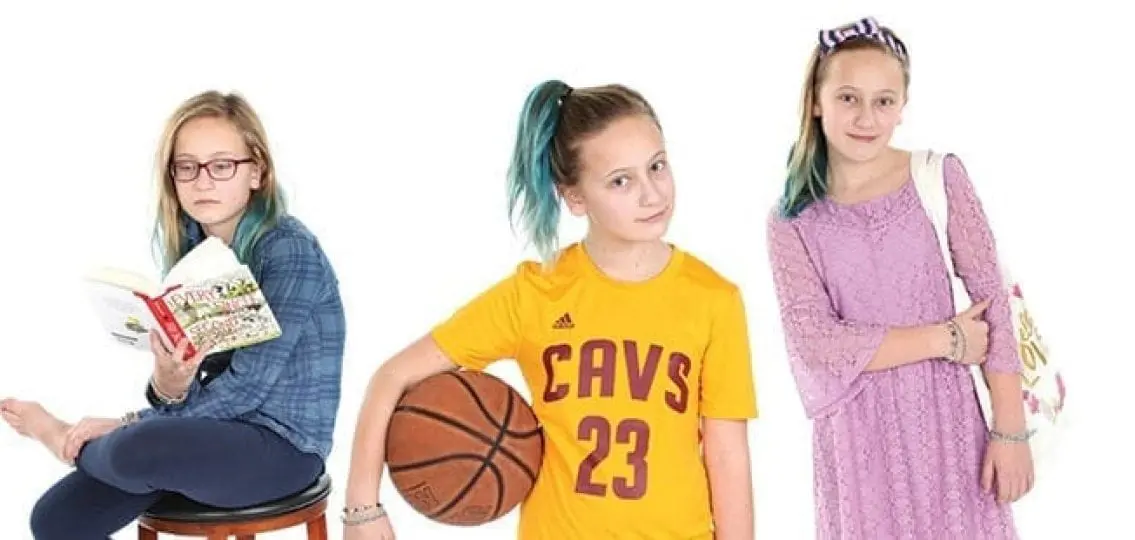 a middle school girl with three different identities: one lacy pink dress one lebron james shirt with a basketball and one plaid outfit reading with glasses