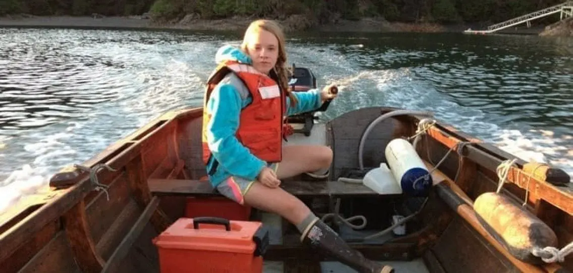 teen girl on a boat in alaska