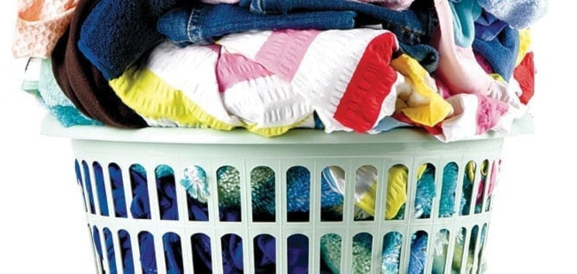 an overflowing laundry basket on a white background