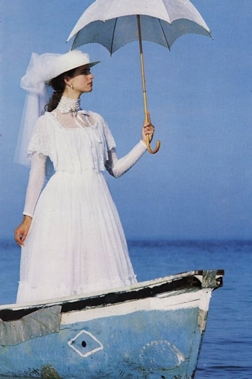 laura_ashley dress model on a boat with an umbrella. Source: Pinterest