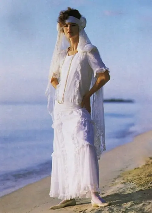 laura_ashley dress model on a beach with a headscarf. Source: Pinterest