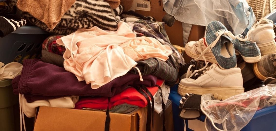 messy teen's bedroom, cluttered house with piles of clothes shoes and boxes