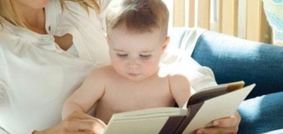 mom reading to a baby