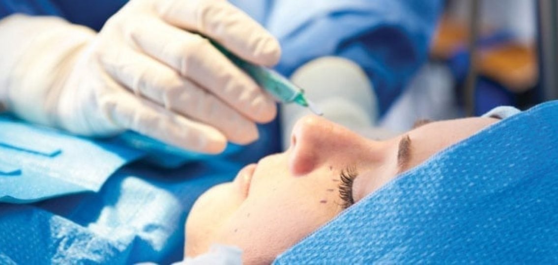 teenage girl under the knife getting plastic surgery on her face