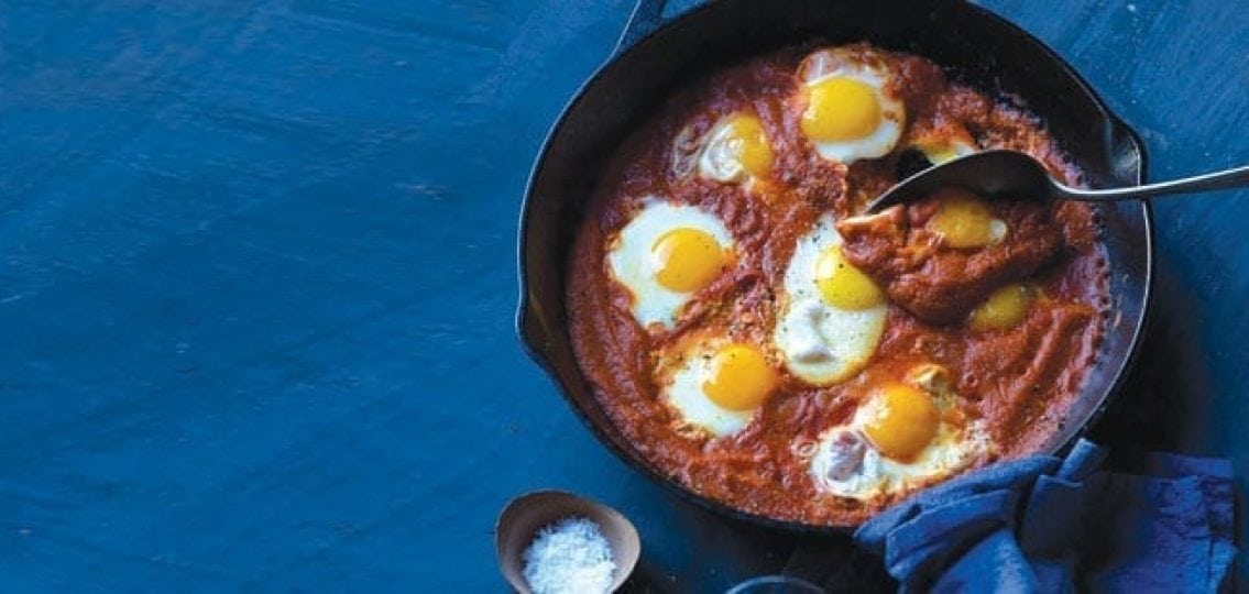 saucy eggs tomato sauce and sunny side up eggs
