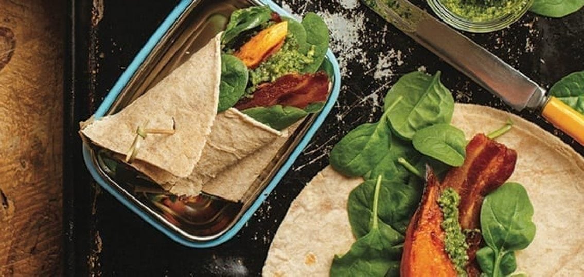 sweet potato wraps with bacon and lettuce on a cutting board