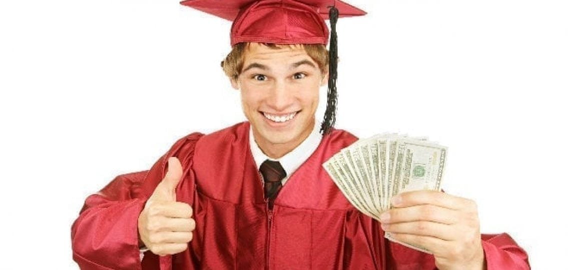 teen graduate in robes and hat holding money giving a thumbs up