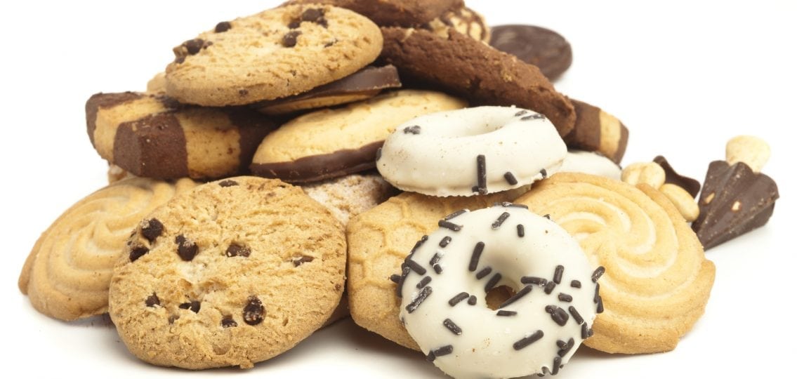 pile of cookies and junk food white background