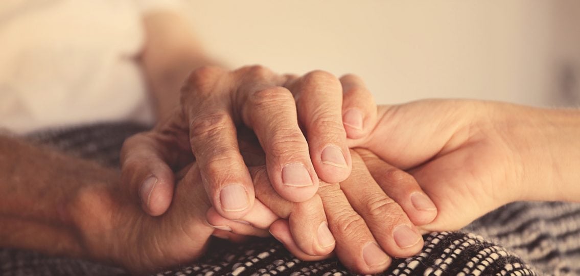 grandparent and grandchild holding hands
