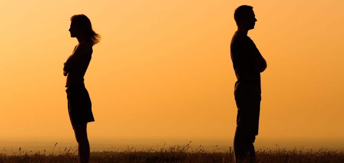 man and woman silhouettes fighting facing away from each other divorce