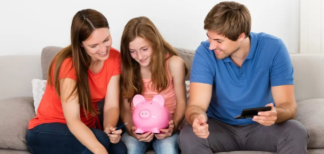 teen and her parents with a piggybank and a calculator