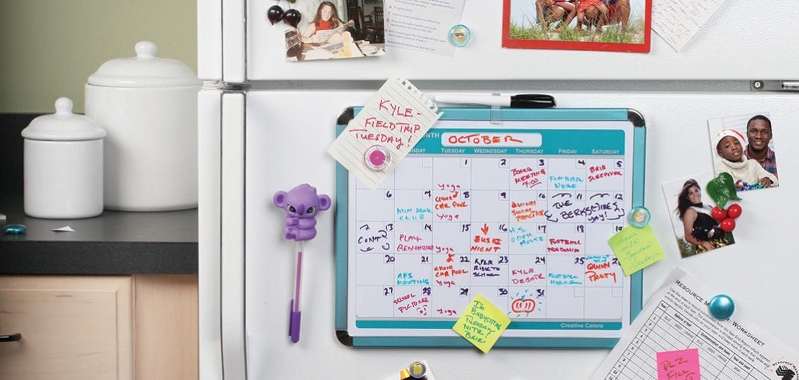 calendar magnet on a fridge overscheduled and chaotic