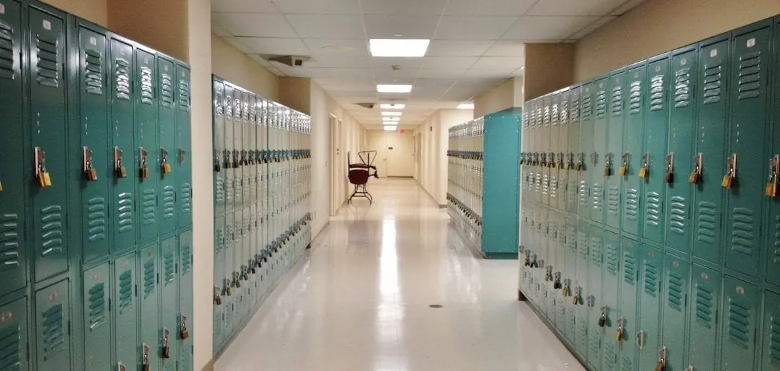 empty school hallway lines with lockers