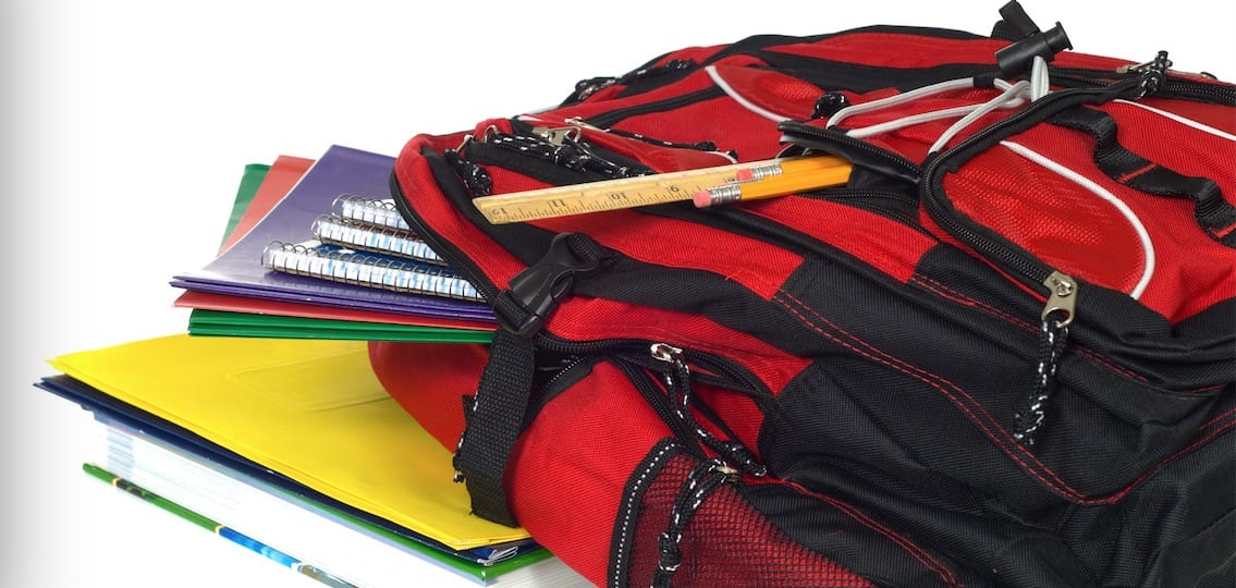 Overstuffed organized Backpack with homework spilling out
