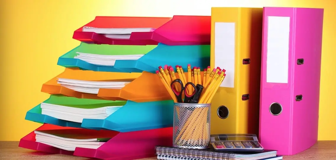 School Supplies Organized in binders and trays on a table