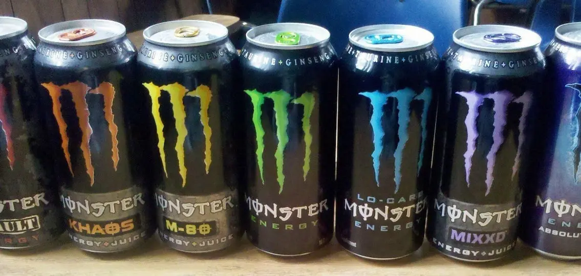 multiple flavors of monster energy drink in a row