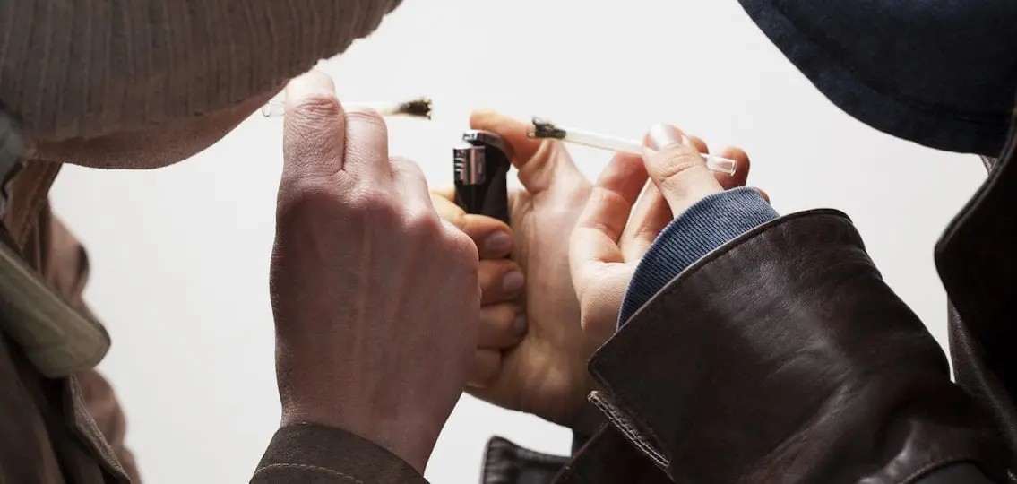 Teens Holding Joints and lighting them on a ligher