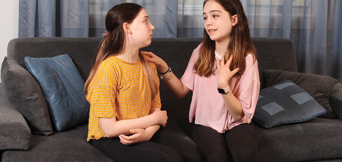 middle school girls friendship breakup one girl upset one girl gently talking