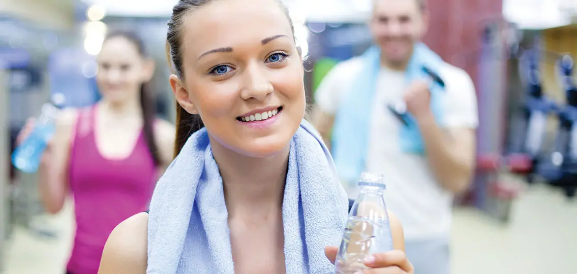 portrait of young woman post-workout in sport gym
