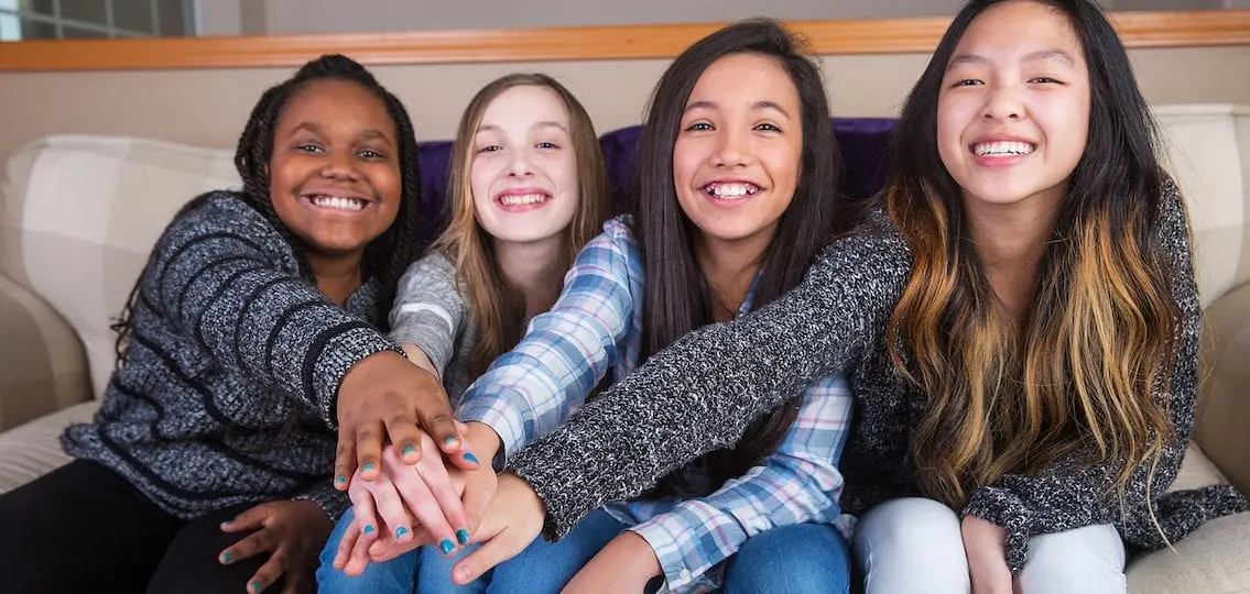 tween Girls hanging out on the couch