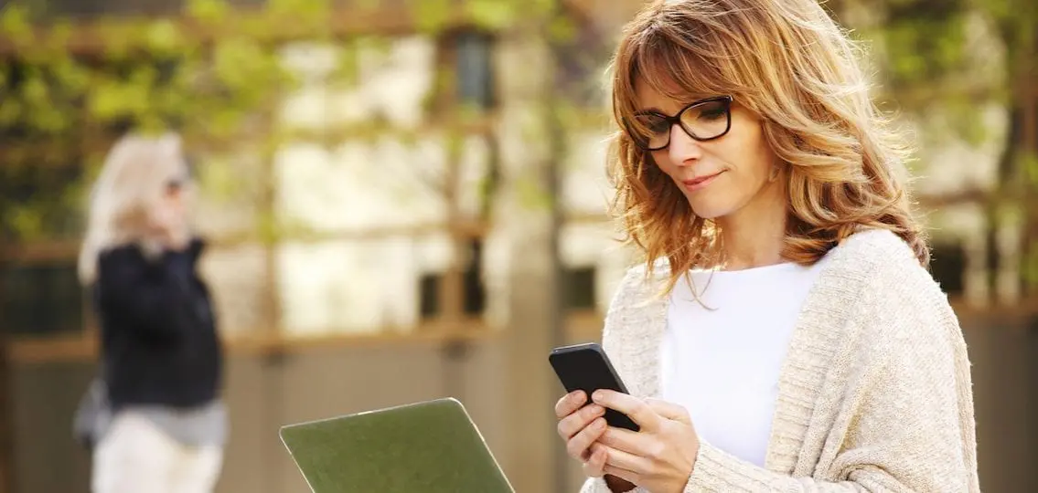 Woman looking at tracker on phone
